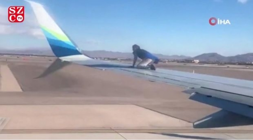 uchusha-hazirlashan-teyyarenin-qanadina-dirmashdi-