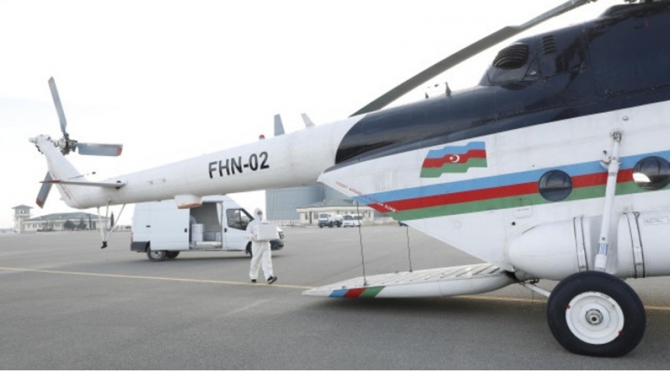 helikopterle-vehshi-heyvanlar-arasinda-quduzluq-xesteliyine-qarshi-peyvendleme-aparilir-foto